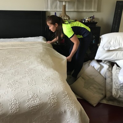 A woman making a bed