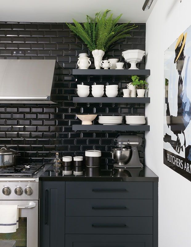 Kitchen with black subway tiles