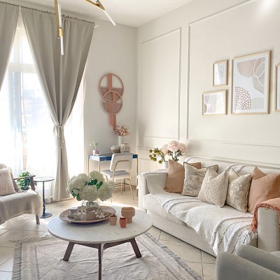A living room filled with furniture and a large window by Vianne Khoury